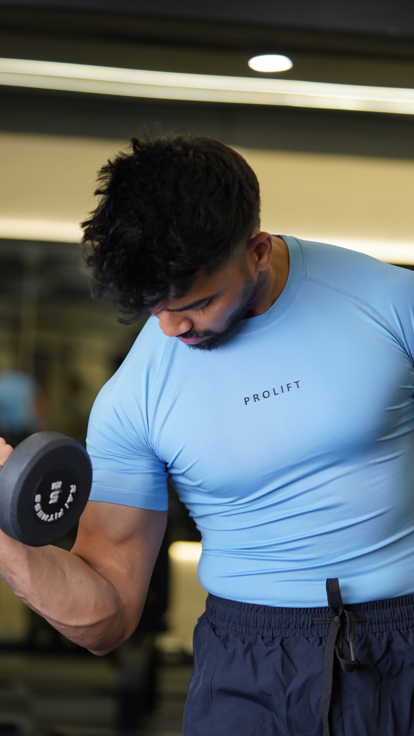 BLUE COMPRESSION AND BLACK TRACKPANTS