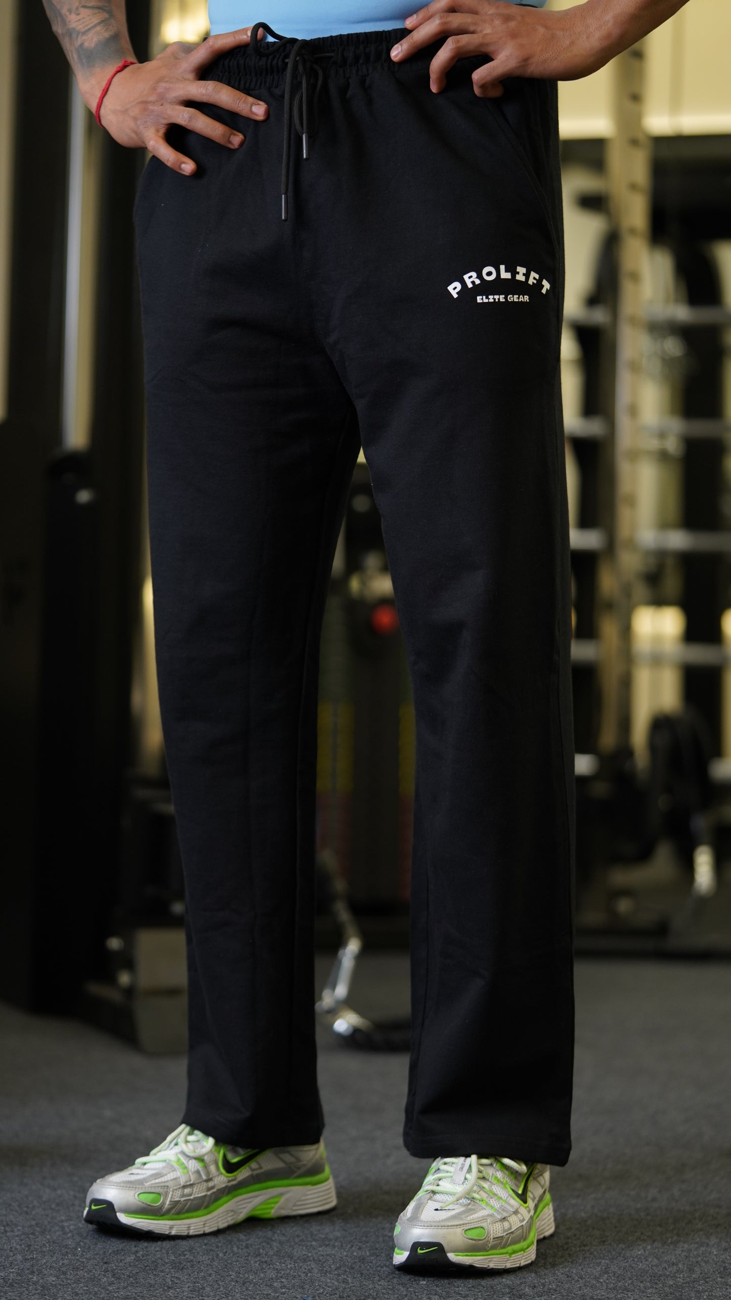 WHITE CAPSELVEES TANK AND BLACK TRACKPANTS