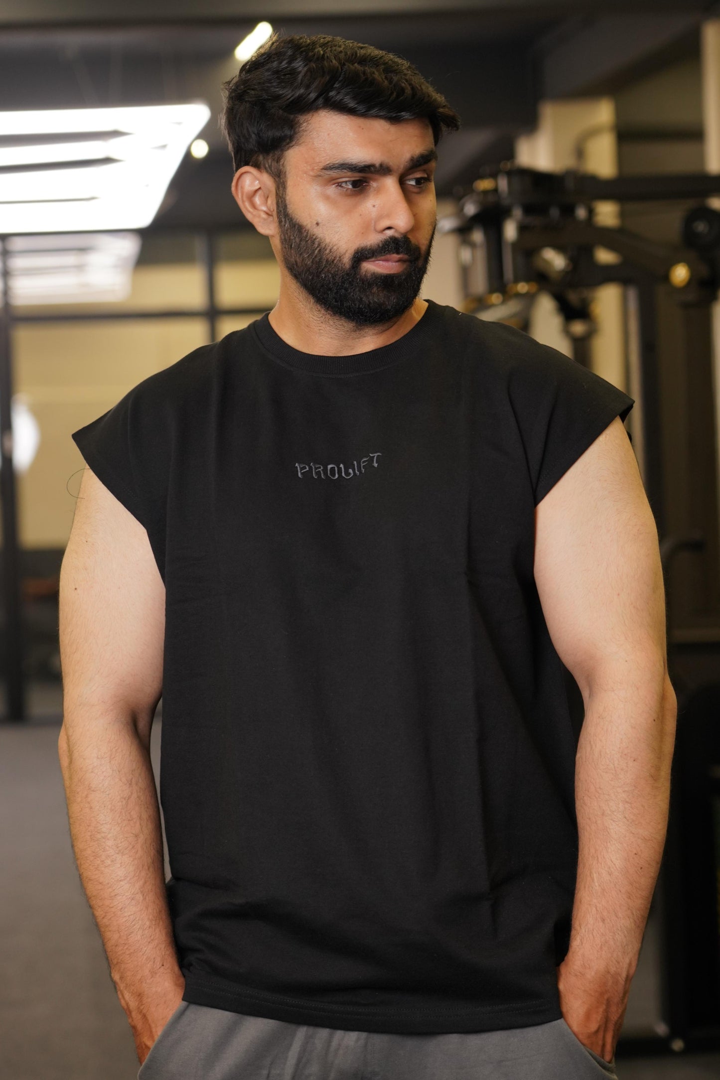 BLACK CAPSELVEES TANK AND GREY TRACKPANTS